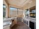 This outdoor kitchen includes a built-in grill, mini-fridge, and sink for easy food preparation at 4193 Stone Creek Loop, Lake Wales, FL 33859