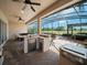 This outdoor living area includes a pool, hot tub, and outdoor kitchen perfect for enjoying time outside at 4193 Stone Creek Loop, Lake Wales, FL 33859