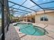 This expansive pool and screened-in lanai is ideal for relaxing and taking a dip in the pool at 4193 Stone Creek Loop, Lake Wales, FL 33859