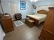 Bright bedroom with modern furnishings and light wood flooring and deer head at 427 Longfellow Blvd, Lakeland, FL 33801