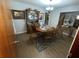 Traditional dining room with a wooden table set for six, hardwood floors, and a china cabinet at 427 Longfellow Blvd, Lakeland, FL 33801