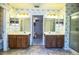 Large bathroom featuring double sinks, wooden cabinets, and an open doorway leading to the bedroom at 4976 Pleasant Hollow Trl, Lakeland, FL 33811
