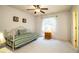 Bedroom featuring a daybed with striped bedding, and a ceiling fan with warm lighting at 4976 Pleasant Hollow Trl, Lakeland, FL 33811