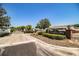 Gated entrance to Colonnades, a 55+ community, featuring lush landscaping and a welcoming sign at 4976 Pleasant Hollow Trl, Lakeland, FL 33811