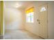 Welcoming entryway featuring neutral tile flooring, a bright window, and a classic front door at 4976 Pleasant Hollow Trl, Lakeland, FL 33811