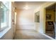 The bright entryway offers neutral tile flooring, plenty of natural light, and a convenient layout at 4976 Pleasant Hollow Trl, Lakeland, FL 33811