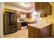 Well-equipped kitchen with stainless steel refrigerator, range, and microwave at 4976 Pleasant Hollow Trl, Lakeland, FL 33811