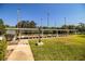 Lawn bowling recreational area with benches and lighting at 4976 Pleasant Hollow Trl, Lakeland, FL 33811