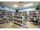 Cozy library featuring floor-to-ceiling bookshelves filled with a vast selection of books and comfortable seating at 4976 Pleasant Hollow Trl, Lakeland, FL 33811