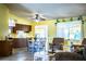 An open-concept living space with a dining area and lots of natural light at 4976 Pleasant Hollow Trl, Lakeland, FL 33811