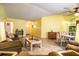 Cozy living room area with views of the kitchen, dining area, and front door at 4976 Pleasant Hollow Trl, Lakeland, FL 33811