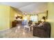 Bright and spacious living area with tile floors, dining area, and view to kitchen at 4976 Pleasant Hollow Trl, Lakeland, FL 33811