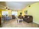 Inviting living room featuring a comfortable seating area and natural light from a large window at 4976 Pleasant Hollow Trl, Lakeland, FL 33811