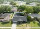 A high angle view shows a home, fenced backyard and neat landscaping in a suburban neighborhood at 502 Duchess Dr, Lakeland, FL 33803