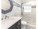 Modern bathroom with marble tile, stylish mirror, and glass-enclosed shower at 502 Duchess Dr, Lakeland, FL 33803