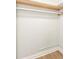 Empty closet features a simple rod and shelf, ready for customization at 502 Duchess Dr, Lakeland, FL 33803