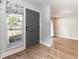 Inviting foyer with stylish door and sidelight with a floral-print Roman shade, and access to a spacious living area at 502 Duchess Dr, Lakeland, FL 33803