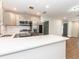 Well-lit kitchen with white countertops, stainless steel appliances, and ample cabinet space at 502 Duchess Dr, Lakeland, FL 33803