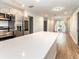 Spacious kitchen with a large white island, stainless steel appliances, and an open floor plan at 502 Duchess Dr, Lakeland, FL 33803