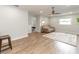 Open living area with a ceiling fan, LVP floors, and a neutral color scheme at 502 Duchess Dr, Lakeland, FL 33803