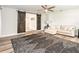 Living room features a large barn door, wood floors, a comfortable couch and stylish decor at 502 Duchess Dr, Lakeland, FL 33803