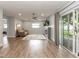Bright living room with modern fireplace, comfortable seating, and access to the backyard at 502 Duchess Dr, Lakeland, FL 33803