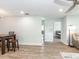 View of living room open to dining area, adjacent to bedroom and bathroom at 502 Duchess Dr, Lakeland, FL 33803