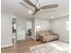 Living room featuring ceiling fan, and comfortable seating, adjacent to bedroom and bathroom at 502 Duchess Dr, Lakeland, FL 33803