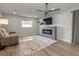 Bright living room with fireplace, TV, and comfortable seating at 502 Duchess Dr, Lakeland, FL 33803