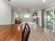 Open living space with fireplace, ceiling fan, and sliding glass doors to the backyard at 502 Duchess Dr, Lakeland, FL 33803