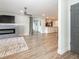 Spacious living room featuring modern fireplace, sleek LVP floors, and sliding glass doors at 502 Duchess Dr, Lakeland, FL 33803