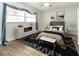 Serene bedroom with a large window, stylish decor, and a comfortable bed with neutral bedding at 502 Duchess Dr, Lakeland, FL 33803