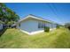Spacious green backyard with well-maintained lawn and view of neighboring homes at 512 Cameo Dr, Lakeland, FL 33803