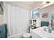Cozy bathroom with shower and tub, white vanity, and mirrored medicine cabinet at 512 Cameo Dr, Lakeland, FL 33803