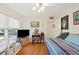 Bright bedroom with wood floors, ceiling fan, and built-in storage at 512 Cameo Dr, Lakeland, FL 33803