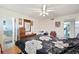 Comfortable bedroom features a ceiling fan, ensuite bathroom, and neutral walls at 512 Cameo Dr, Lakeland, FL 33803