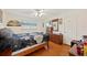 Spacious bedroom with wood floors, a ceiling fan, and a large window at 512 Cameo Dr, Lakeland, FL 33803