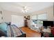 Bedroom features wood floors, a ceiling fan, large closet, and natural light at 512 Cameo Dr, Lakeland, FL 33803