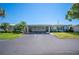 Well-maintained single-story home with a covered carport and long driveway at 512 Cameo Dr, Lakeland, FL 33803