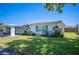 Charming single-story home with well-manicured lawn and beautiful landscaping at 512 Cameo Dr, Lakeland, FL 33803