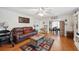 Inviting living room with wood floors, comfortable seating, and a decorative rug creating a warm atmosphere at 512 Cameo Dr, Lakeland, FL 33803
