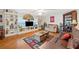 Bright living room with built-in shelves, hardwood floors, and sofas at 512 Cameo Dr, Lakeland, FL 33803