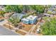 An aerial perspective of a well-maintained home with lush greenery and surrounding foliage at 523 W Hancock St, Lakeland, FL 33803
