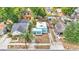 An aerial view of several quaint homes nestled in a vibrant and lush neighborhood at 523 W Hancock St, Lakeland, FL 33803