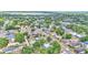 An aerial view showing the community near a lake, nestled among lush trees and roadways at 523 W Hancock St, Lakeland, FL 33803
