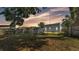 Fenced backyard with grass lawn and shed, offering a private outdoor space at 523 W Hancock St, Lakeland, FL 33803