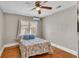 Bedroom with wood floors, ceiling fan and a comfortable bed at 523 W Hancock St, Lakeland, FL 33803