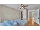 Bedroom featuring a closet, ceiling fan, and comfortable bedding at 523 W Hancock St, Lakeland, FL 33803