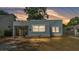 The exterior showcases a simple modern home with a covered carport at 523 W Hancock St, Lakeland, FL 33803