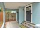Inviting front porch with colorful tiled steps and a modern black front door at 523 W Hancock St, Lakeland, FL 33803